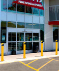 46 Inch Removable Steel Safety Bollard With Bright Yellow Powder Coat Embedding Sleeve No Sweat Swap Locking Ring For Tough As Nails Traffic Control And Parking Lots at store entrance