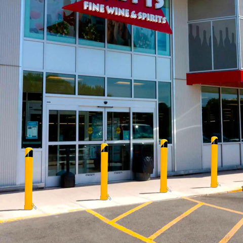46 Inch Removable Steel Safety Bollard With Bright Yellow Powder Coat Embedding Sleeve No Sweat Swap Locking Ring For Tough As Nails Traffic Control And Parking Lots at store entrance