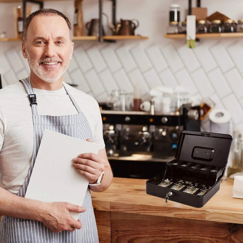 Smiling shop owner next to Lockable Cash Box With Money Tray For Cash Register Till, Metal Heavy Duty Safe Box on counter.