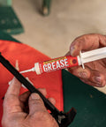 All Weather Synthetic Grease For Firearms High Tech Lubricant That Clings In Extreme Heat Or Cold 10cc syringe in use