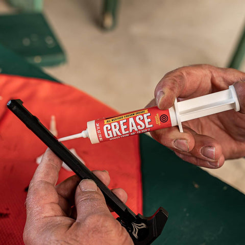 All Weather Synthetic Grease For Firearms High Tech Lubricant That Clings In Extreme Heat Or Cold 10cc syringe in use