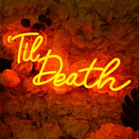 Til Death Neon Light Sign USB Powered LED Decor For Halloween Weddings Parties And Bridal Showers 17 Inch Orange Bedroom Wall Decor With On Off Switch 5V Dope Vibe glowing against floral backdrop.