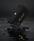 Emberton II Portable Bluetooth Speaker With 360 Degree True Stereophonic Sound, rugged black and brass, splashing water
