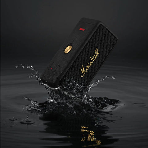 Emberton II Portable Bluetooth Speaker With 360 Degree True Stereophonic Sound, rugged black and brass, splashing water