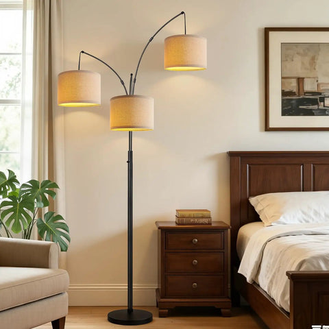 Fully Dimmable Three Light Arc Floor Lamp With Beige Shades in bedroom, modern tall standing tree lamp with black base.