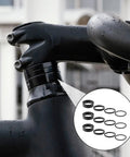 Twelve Piece Aluminum Alloy Bike Stem Spacers Set For One And One Eighth Inch Headset Spacers shown on a bike handlebar