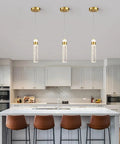 Gold Crystal Pendant Light For Kitchen Island, 4000K LED Modern Adjustable Chandelier in a stylish kitchen setting.