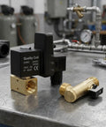 Auto Drain Valve For Air Compressor Condensate Management Electronic Timer Control Adjustable Discharge System on a workbench.