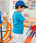 Child playing with Two Lane Starting Gate For Toy Car Tracks Lets You Launch Two Cars At Once Quick Plug And Play Install In Seconds No Tools Required Compatible With Most Track Systems For A Dope Raceway Upgrade