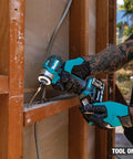 A person using a No-Bull 18 Volt Cordless Impact Driver Built Around A Brushless Motor And Four Speed Quick Shift Mode delivering precision in fastening.