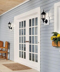 Coastal White Outdoor Wall Light with Clear Beveled Glass 17 Inch Tall 1 Light Exterior Porch Lantern on blue house siding
