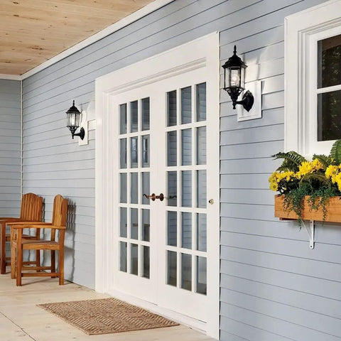 Coastal White Outdoor Wall Light with Clear Beveled Glass 17 Inch Tall 1 Light Exterior Porch Lantern on blue house siding