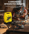 Man using saw beside 30 Ft Retractable Extension Cord Reel With 4 Grounded Outlets, 13 Amp Circuit Breaker in workshop
