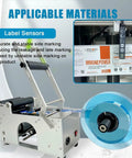 Semi Automatic Round Bottle Labeler Machine With Adjustable Platform And Pressure Bar Fits Half To Six Inch Containers Cranking Out Fifteen To Thirty Labels Per Minute, showing label sensors and labels.