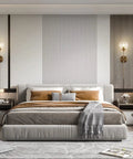 Brushed Gold Plug In Wall Sconce Set Of 2 Mid Century Modern Long Globe Lights with Amber Glass beside a stylish bed in modern room