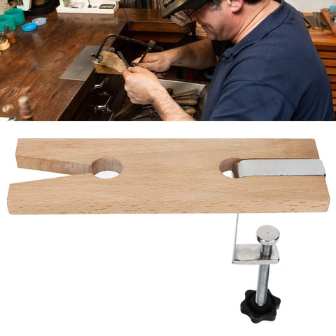 Wooden Jewelers Bench Pin with Heavy Duty C Clamp for ring polishing, shown on a workbench in a jewelry studio.