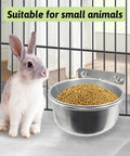 Front view of stainless steel bird cage bowl with clamp mounted on cage, filled with pellet food.