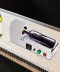 Straight Up Pro 110V Wine Bottle Cap Shrink Sealer Machine With Smart Digital Thermostat And Super Quick Heating Coils in use on countertop.