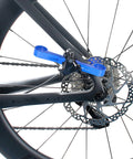 Bike Piston Press Tool For Disc Brakes, Brake Pad Spreader For Shimano And Other Brand Calipers in use, mounted on bike wheel