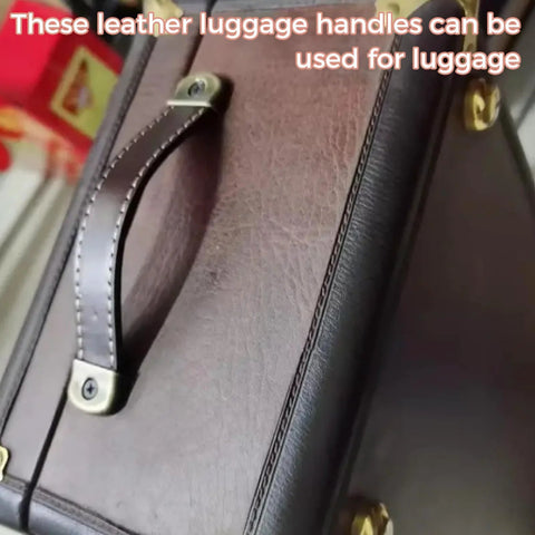 Close-up of brown leather luggage handle attached to suitcase.