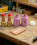 Ultimate 10 Piece Tig Gas Lens Kit For Wp 17 18 And 26 Welding Torch, includes collets and nozzles on wood surface.