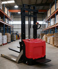 Heavy Duty Electric Walkie Pallet Stacker With 1000Kg To 3000Kg Lift Capacity, red color, in warehouse aisle handling materials.
