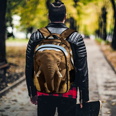 Unisex Elephant Print Backpack With Wilderness Design worn by person in park, showcasing large capacity and durable construction