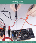 Long Reach Multimeter Probes With Sharp Insulated Tips, 155mm Stainless Steel Pins for 4 Mm Test Leads in use on circuit board