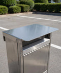 Kickass Stainless Steel EV Charger Protective Housing And Super Tough Weatherproof Outdoor Box Cover For All Season Rain Wind Snow Shield And Hella Durable Electric Vehicle Charging Station Shell shown from top angle with shiny finish.