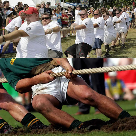 Group of people in a tug-of-war using a Natural Jute Rope One And A Half Inch By Ninety Six Feet Four Strand Twisted Rope