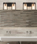 Two Light Over Mirror Bathroom Light Fixture In Rustic Farmhouse Style Industrial Metal Cage Wall Sconce With Matte Black Frame And Antique Brass Accents 14.56 Inch Length Dope Vintage Vanity Lighting For Bathrooms over a modern sink and tiled wall