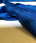 Close-up of Blue 10 Ft Endless Round Sling 21200 Lb Vertical WLL And 42400 Lb Basket Capacity on light surface