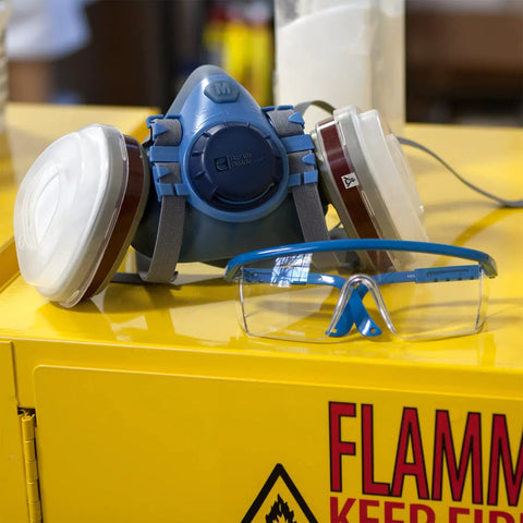 Pro Grade Half Mask Respirator With Reusable Filters And Safety Glasses For Dust Pollen And Organic Vapor Protection on yellow surface