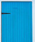 Heavy Duty 12 Inch Iron T Shape Door Hinges With Ball Bearing Hardware on a blue door, black gate hinge visible