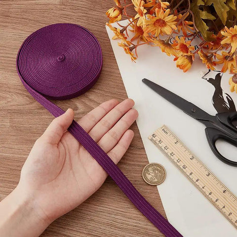 Purple Ito Sageo Wrapping Cord 5m Silk Cotton Blend 0.51 Inch Wide For Katana Tsukamaki next to hand, scissors and flowers