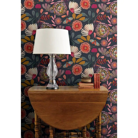 Custom Printed Colorful Blue Floral Vinyl Wallcovering Featuring Subtle Leather Texture on dark background with lamp and wooden table.