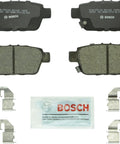 Bosch BC1103 QuietCast ceramic rear brake pad set with 4 pads, mounting hardware clips, and lubricant packet included