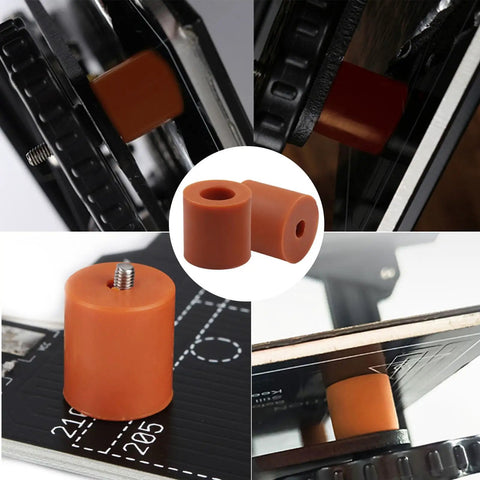 12 Pack Silicone Bed Mounts And Leveling Springs For 3D Printers in orange, shown installed on a 3D printer