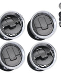 Four round Ford F-150 dashboard AC vent louvers with black centers and chrome rims.