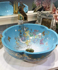 USZWBY Bathroom Vessel Sink, Countertop Basin Ceramic Sink in blue with floral design, round shape, decorative countertop use.