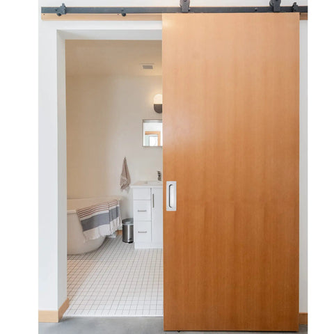 Dead Simple Seven Inch Recessed Pocket Door Pull With Rock Solid Rust Proof Brushed Stainless Steel Slide Grip Handle For Easy Glide Barn Doors And Tight Cabinet Installations on a sliding barn door opening to a bathroom.