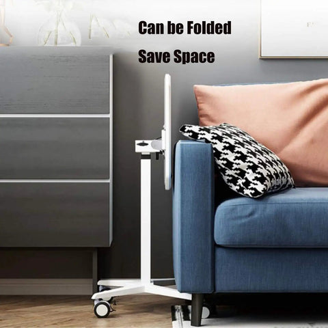 Top Shelf Rolling Laptop Desk With Smooth Moving Casters And Fully Adjustable Height That Tilts Zero To Ninety Degrees For Ultimate Home Office Setup Effortless Studying Or Kick Back Gaming Vibes Anywhere You Park It, shown next to a sofa with space-saving design.