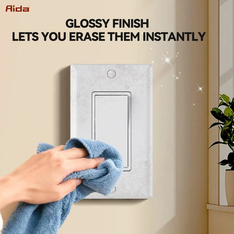 Cleaning a glossy 1-Gang Standard Light Switch Cover Plate in glossy white made from unbreakable polycarbonate installed on wall.