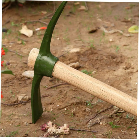 Steel Garden Pickaxe With Wooden Handle For Weeding And Soil Cultivation, Durable Hand Hoe resting on soil with green blade.