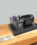 Heavy Duty Bench Mount Lawn Mower Blade Sharpener with Seven Inch Ceramic Grinding Wheel on workbench.