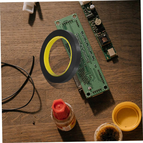 Light Shielding Tape Blackout Tape For Monitors And Windows on wooden desk with electronic components