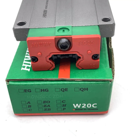 Close-up of Quad Load Linear Guide Kit HGH20CA HGH20HA HGW20CC HGW20HC HGR20 Rails Carriage Bearings on green box
