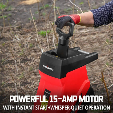 Person operating Electric Wood Chipper Shredder For Home Yard Cleanup With A 15 Amp Motor. Focus on handle and control area.