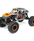 Capra UTB18 One Eighteenth Scale RC Crawler 4WD RTR with tube chassis, orange details, gray multicolor body in focus
