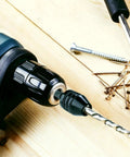 Close-up of Two Pack Keyless Drill Chuck Adapters with One Quarter Inch Hex Shank attached to impact driver, black and silver colors visible.